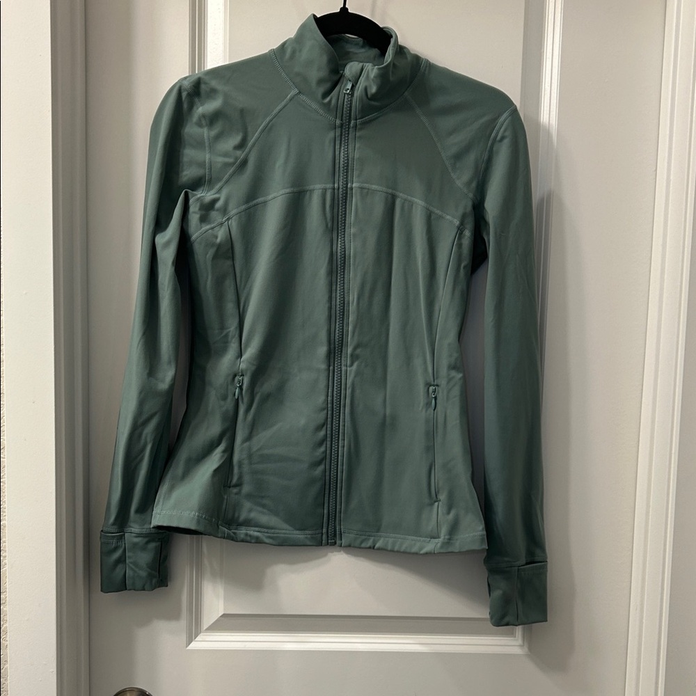 Women's Running Girl sage green Jacket. Zip up. Thumb holes. Pockets.